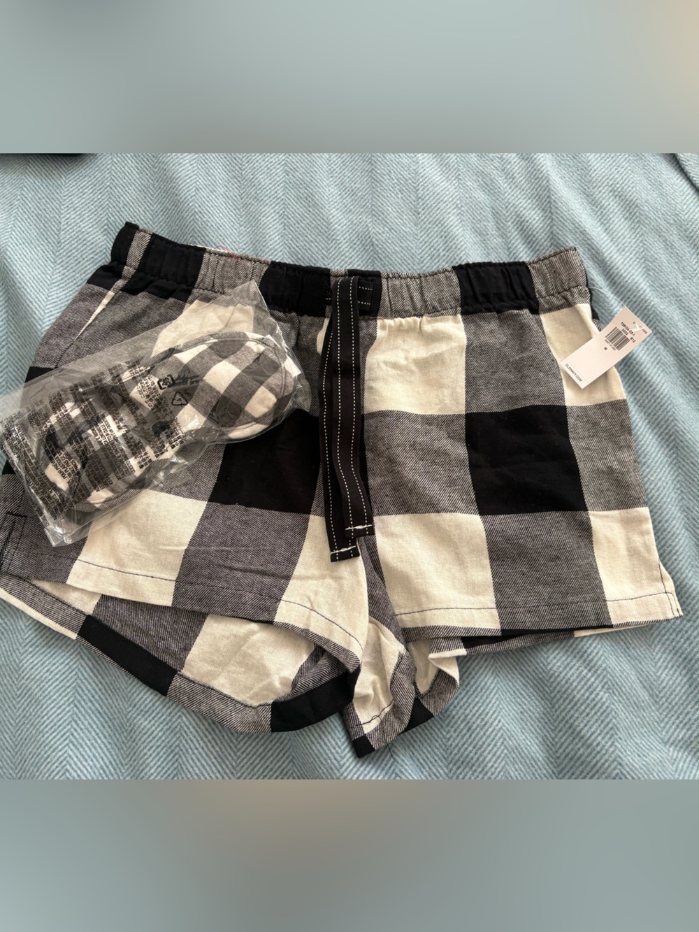 Old Navy Black and White Buffalo Plaid Shorts and eye mask